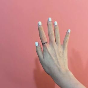 Letters on Fingers As Ring Tattoo